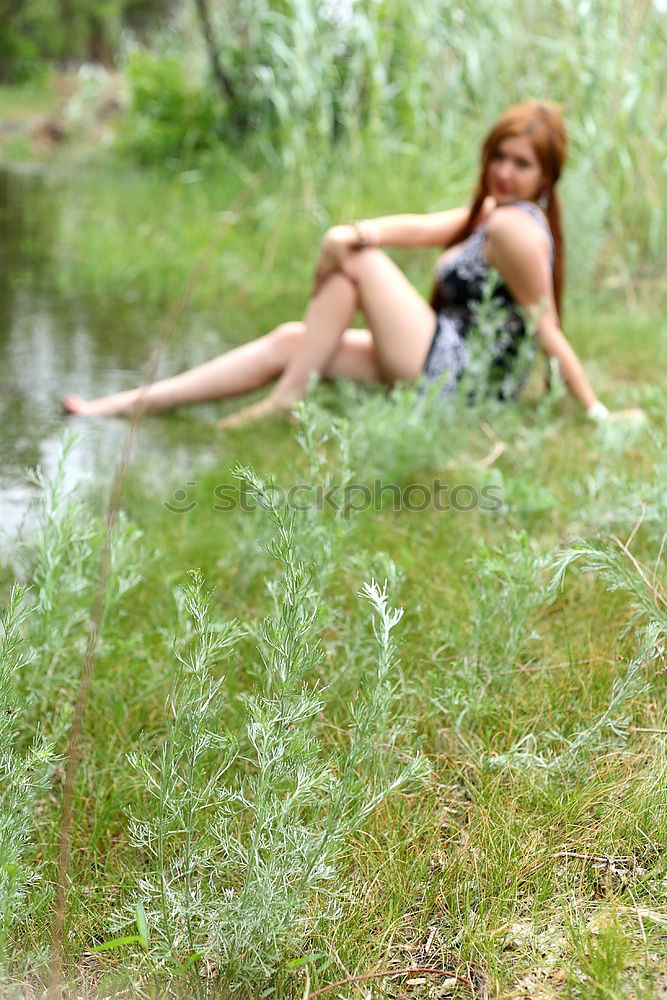 Similar – Image, Stock Photo analog medium format portrait of young woman in summer dress sitting barefoot among bushes in nature on a lakeside