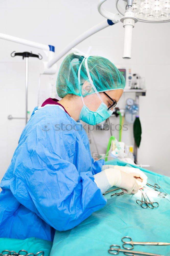 Similar – Image, Stock Photo Team of Surgeons Operating.