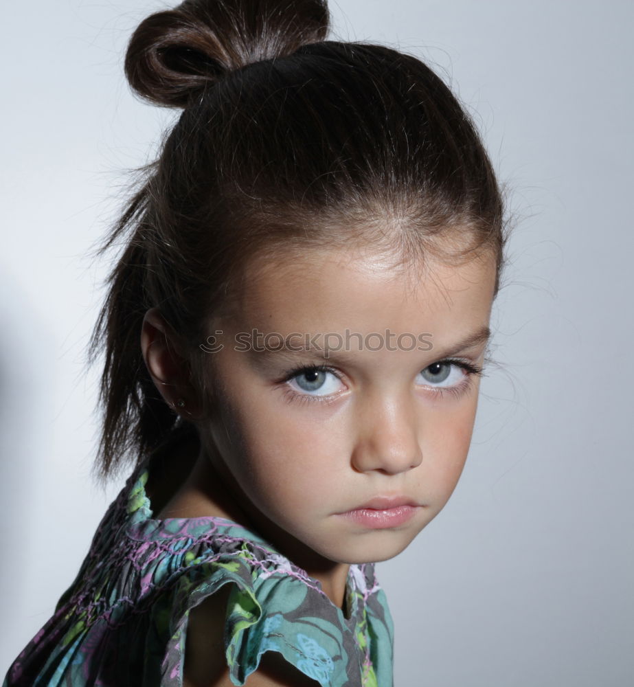 Similar – sad little girl holding toy with her hands