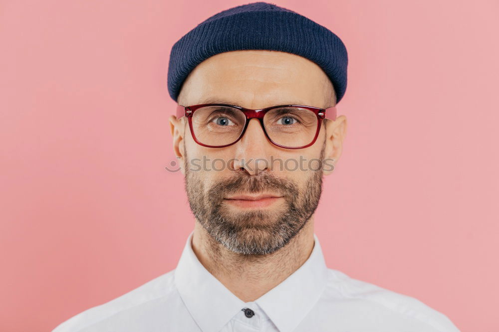 Similar – Man with mustache and glasses standing with crossed arms.