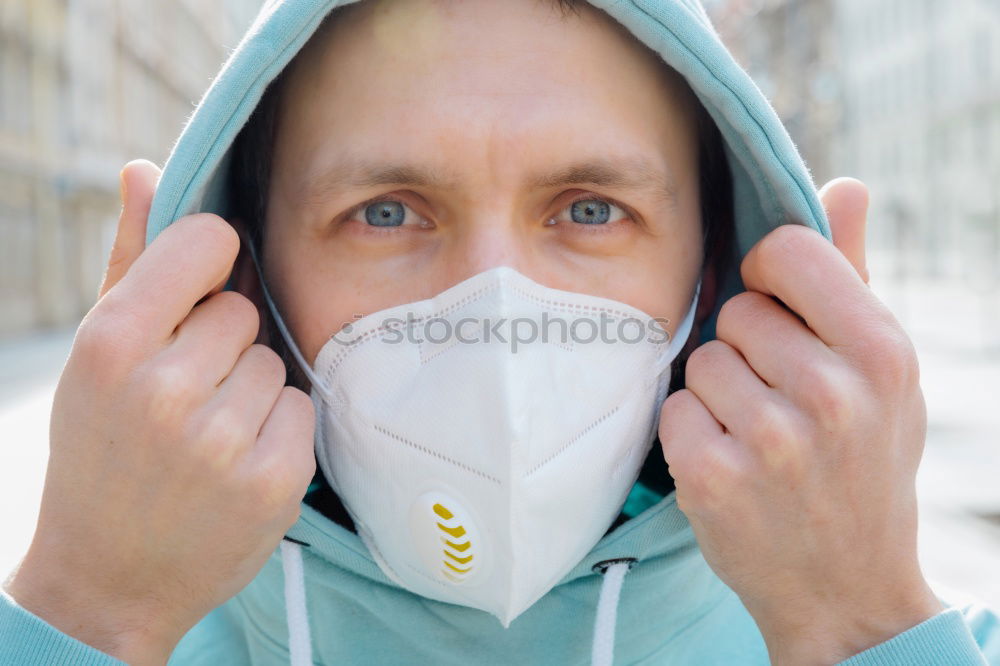 Similar – young woman wearing a mask and fogged glasses in autumn / winter (Corona / Covid-19)