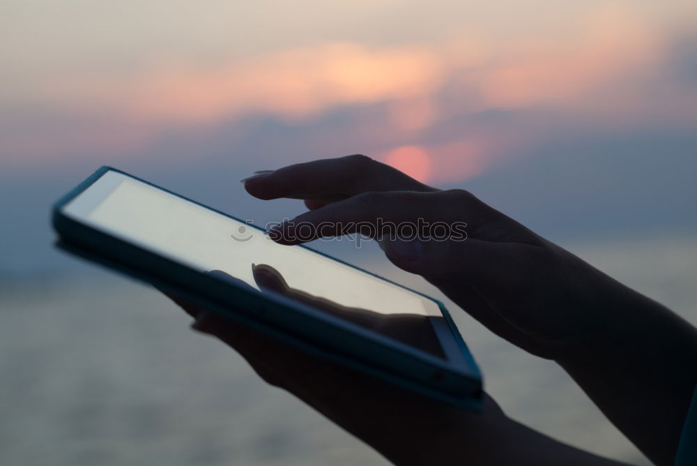 Similar – Image, Stock Photo Close-up shot ofwoman working with tablet computer on sunset and sea background