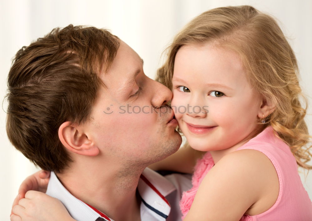 Similar – Father and daughter playing at home. Little girl closing dads eyes with hands and laughing. Family fun together