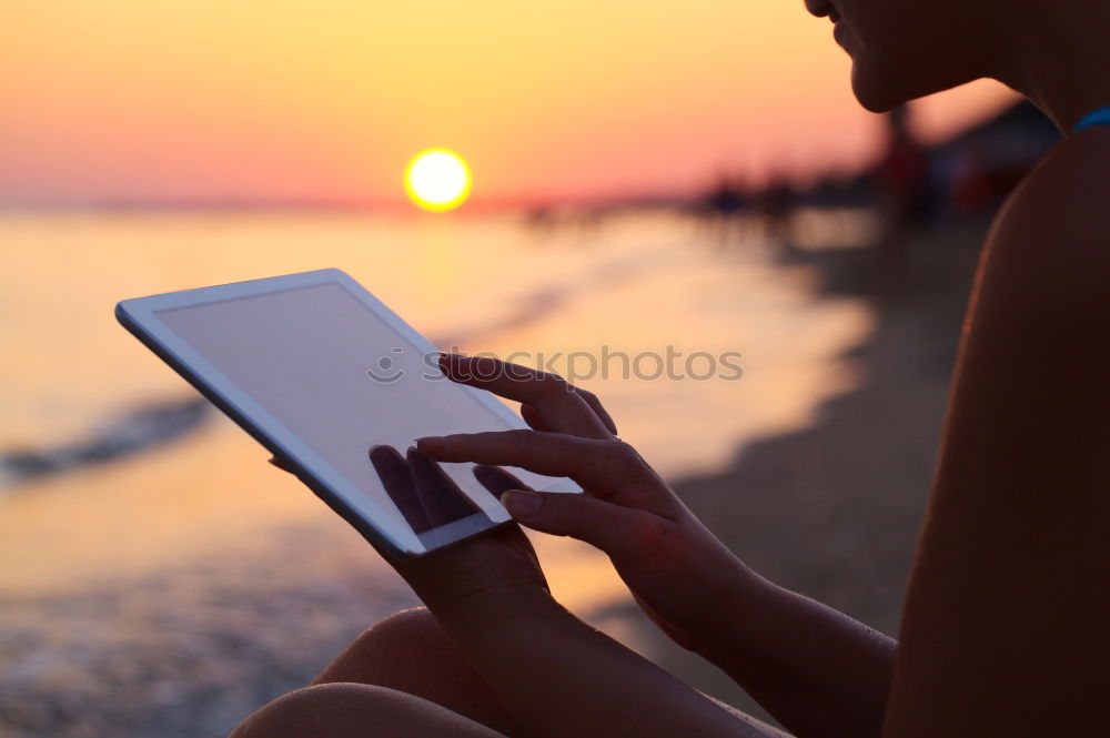 Similar – Image, Stock Photo Happy young woman with tablet PC on beach at sunset. Evening sun, sea and beach on background