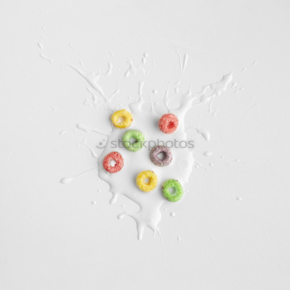 Similar – small chocolate candies with colourful sugar sprinkles on white background