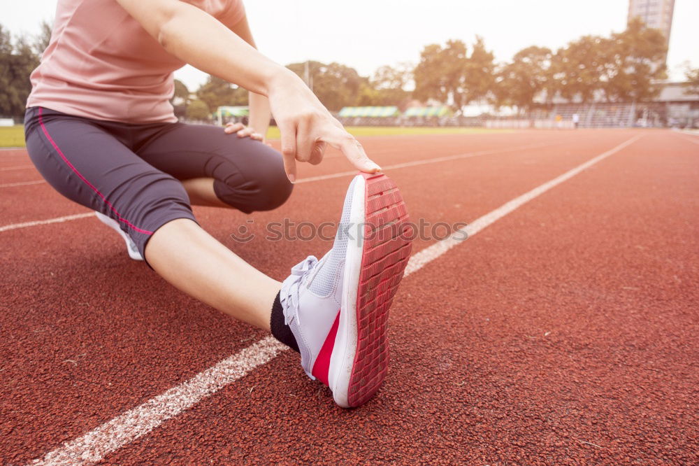 Runner get ready for run, tying sneakers shoelaces