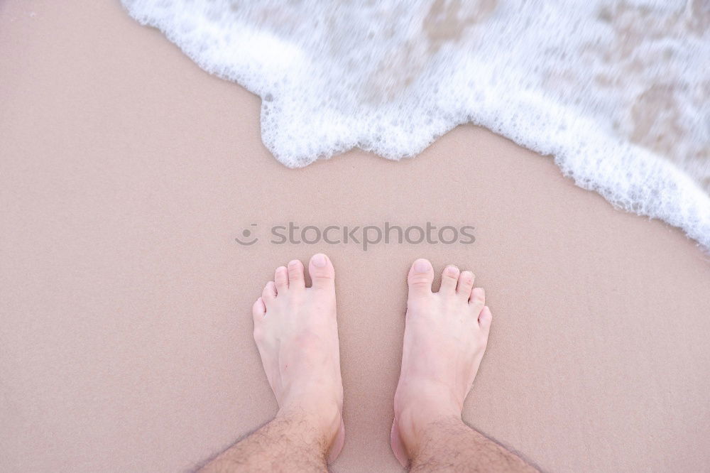 man takes a beach walk