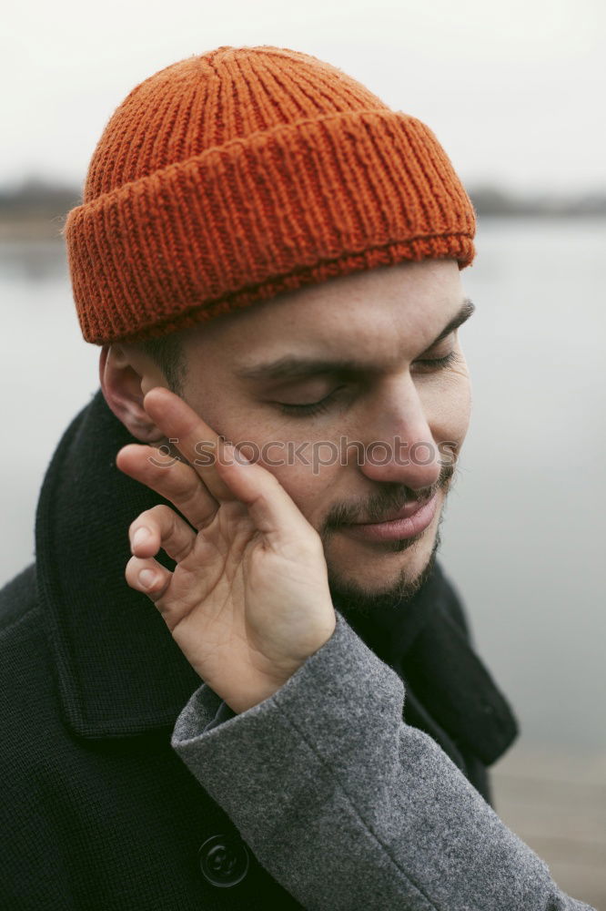 Similar – Image, Stock Photo Handsome man posing on orange wall