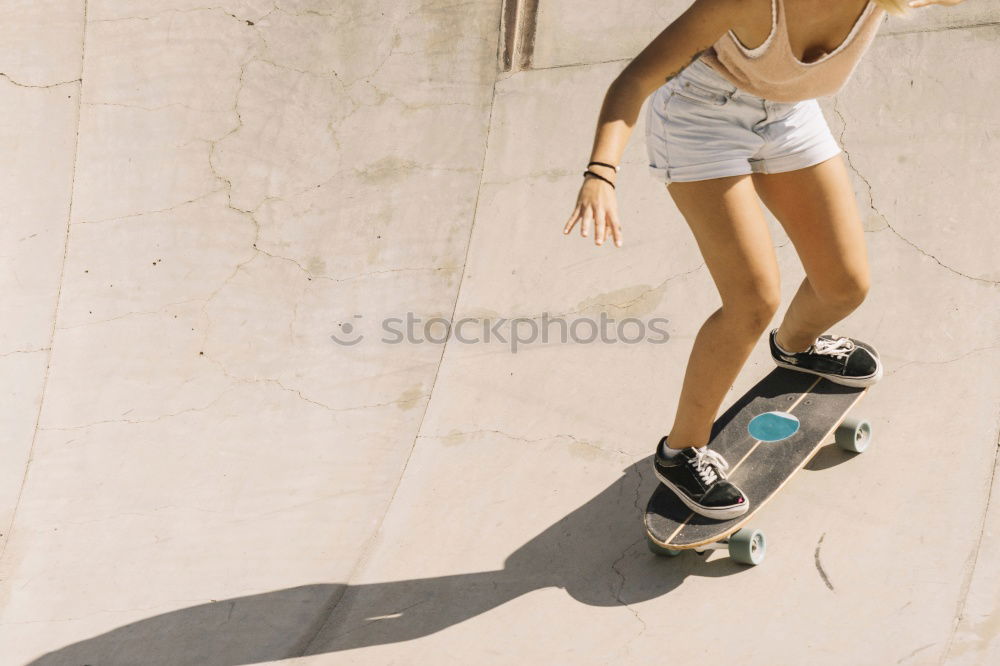 Similar – Image, Stock Photo Beautiful skater woman riding on her longboard.