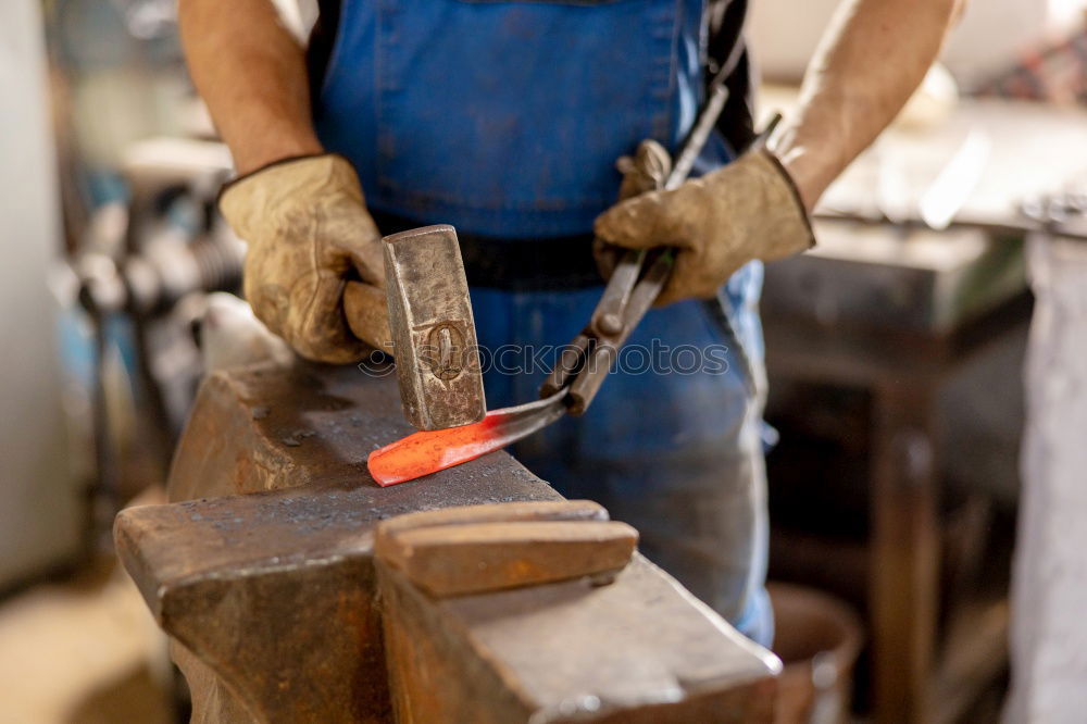 Similar – Professional carpenter with circular saw