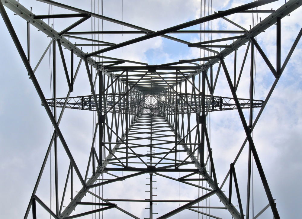 Similar – Power pole from the inside from the frog’s perspective in front of a blue sky