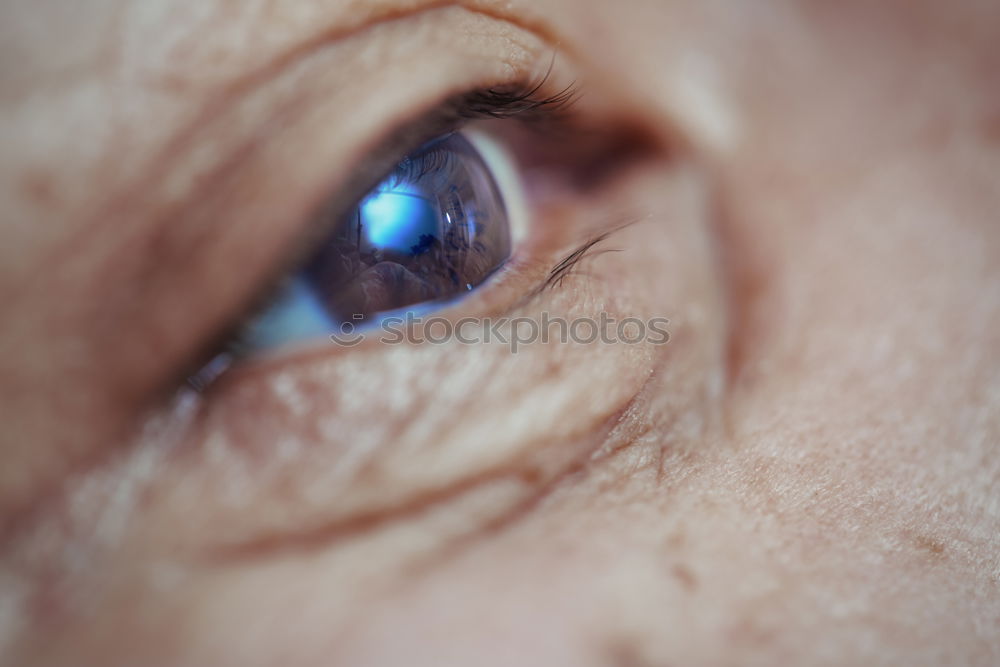 white-haired senior with many wrinkles remembers