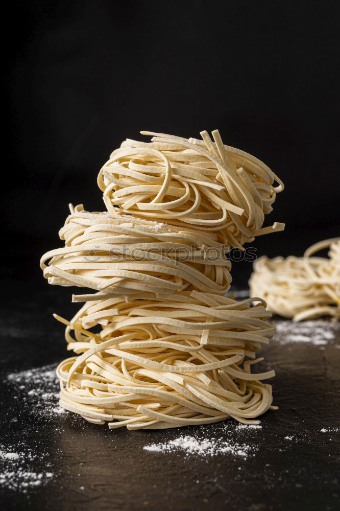 Similar – Image, Stock Photo Making homemade taglatelle with a pasta rolling cutter