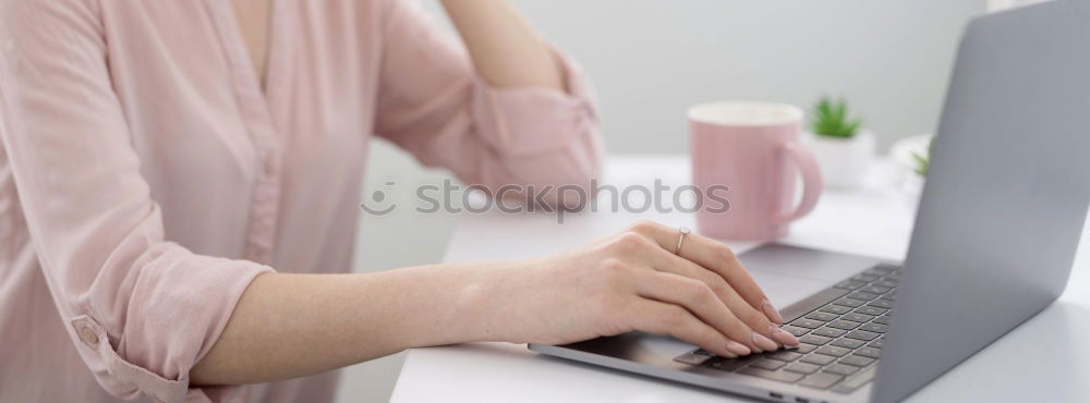 Similar – Woman measuring her own blood pressure at home.