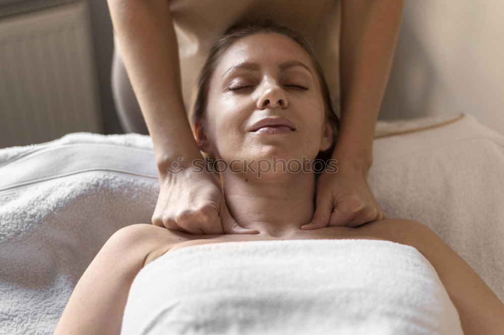 Similar – Massage therapist doing lymphatic drainage treatment to woman