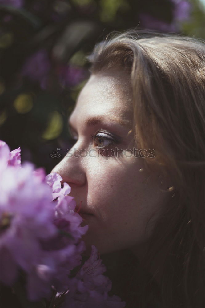 Image, Stock Photo Lifestyle portrait of happy young adult woman enjoying flowers
