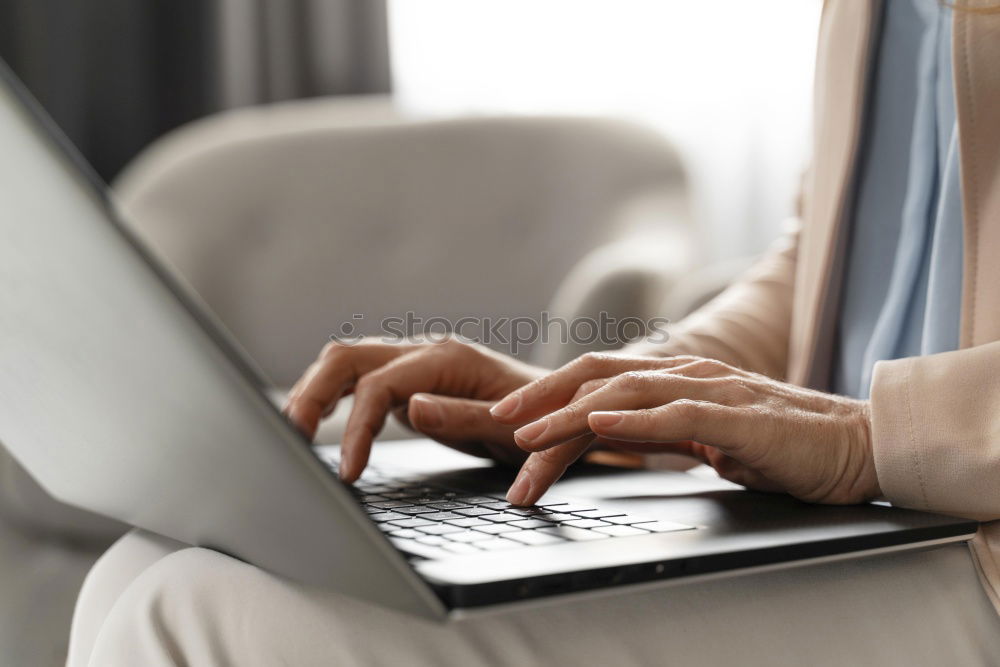 Similar – Two businessman meeting and using smartphone with laptop at outdoor cafe