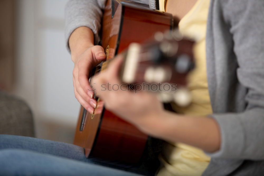 Similar – Foto Bild Eine Frau spielt barfuß Gitarre