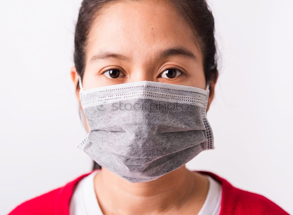 Similar – Brunette woman wearing a mask