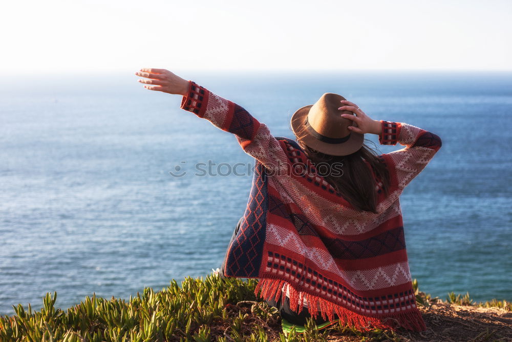 Similar – Image, Stock Photo Woman on stones near sea coast