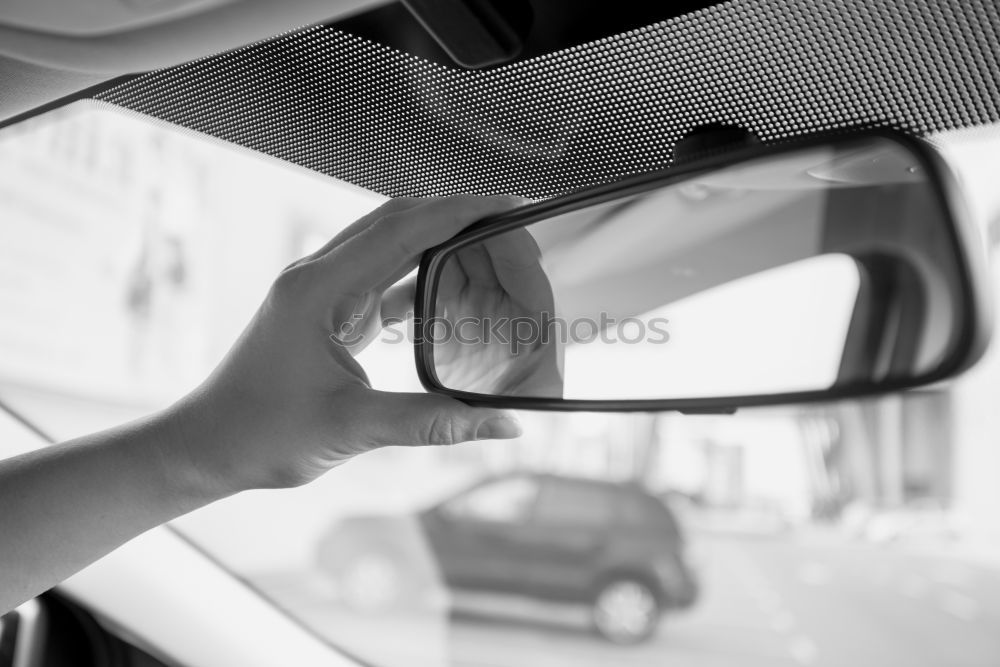 Similar – Image, Stock Photo Sunny car ride. View through the windshield onto the highway. Eyes and glasses of the driver as reflection in the rear view mirror.