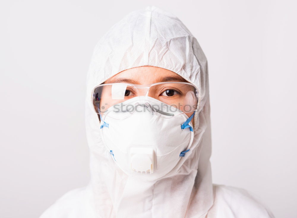 Similar – Image, Stock Photo Nurse with mouth guard examines laboratory sample