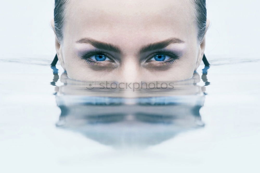 Similar – Image, Stock Photo Woman looking at camera in water