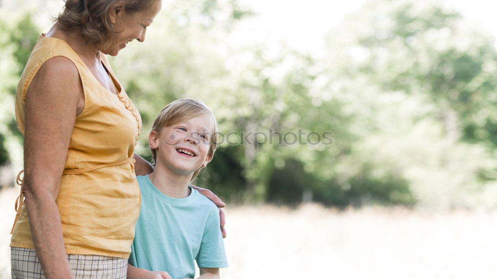 Image, Stock Photo Grandson hugging to his grandmother outdoors