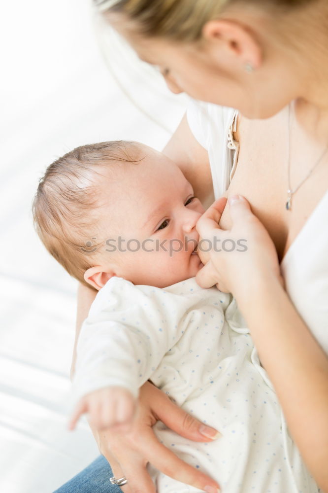 Similar – Image, Stock Photo Young Mother holding newborn baby