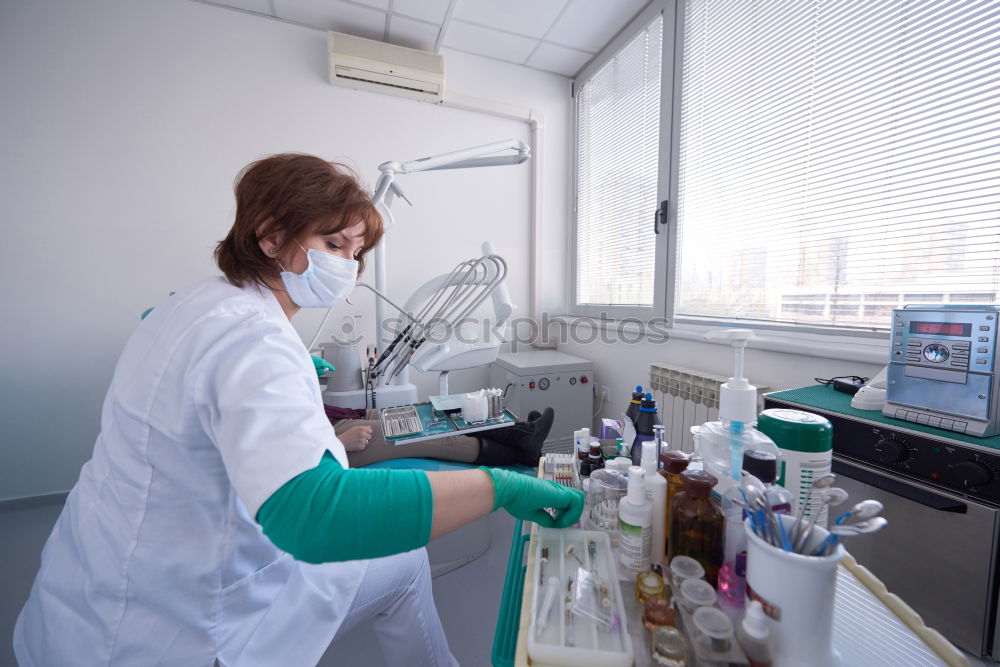 Similar – Worker putting liquid to test tube