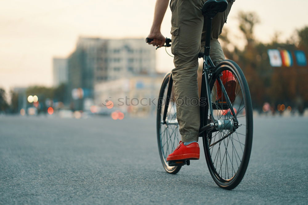 Similar – Handsome afro man walking with his bike.