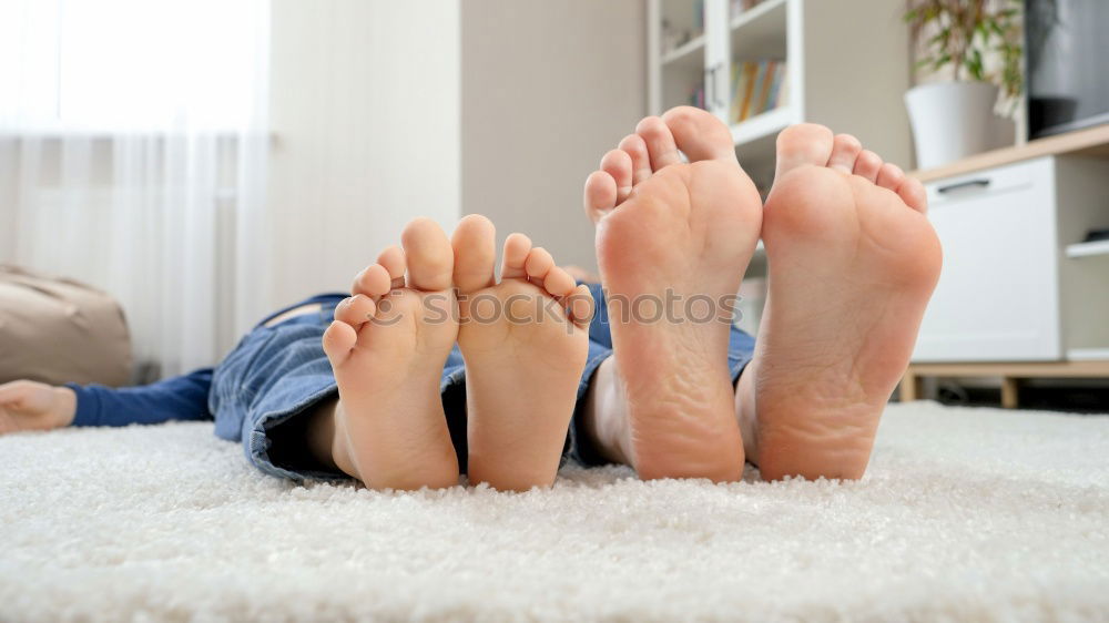 Similar – Happy children sitting on the bed barefoot.