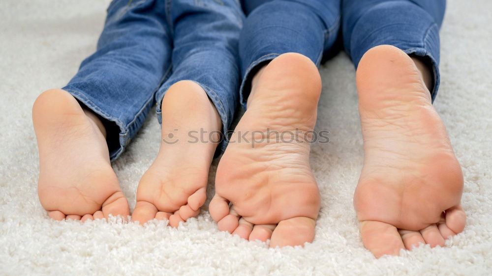 Similar – Happy children sitting on the bed barefoot.