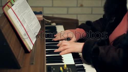 Similar – Image, Stock Photo Overhead view of pianist playing piano at home