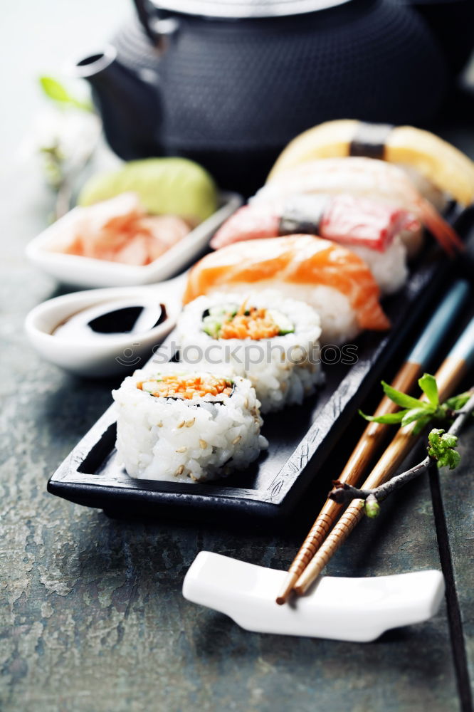 Similar – Crop woman eating sushi