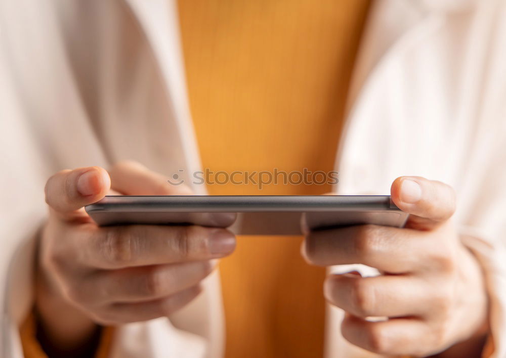 Similar – Close up of hands using smartphone