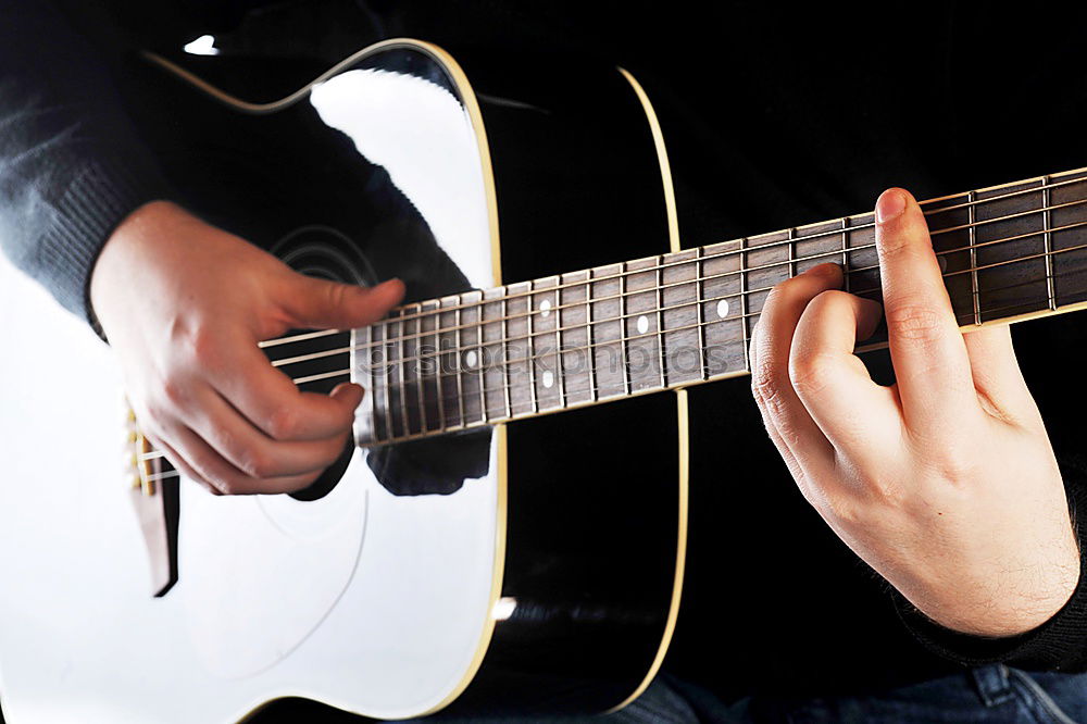 Similar – Young man playing acoustic guitar