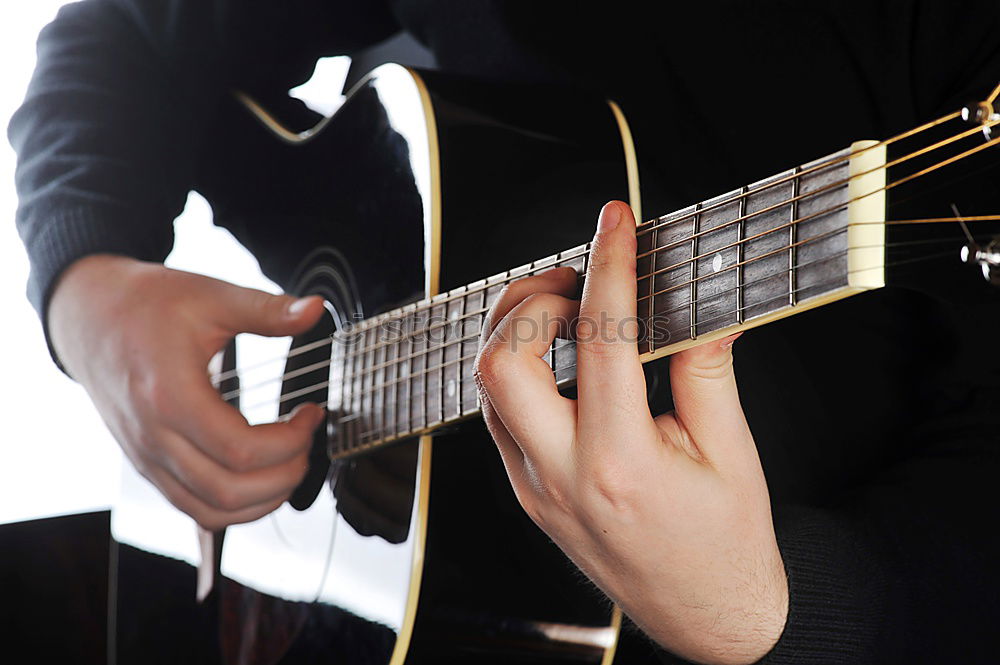 Similar – Young man playing acoustic guitar