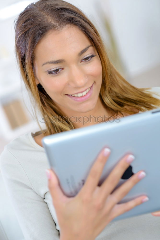 Similar – Young asian woman smiling and using tablet