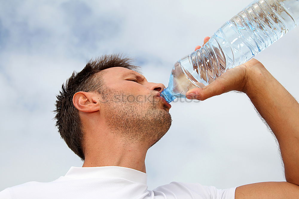 Similar – Young man drinking bottled water