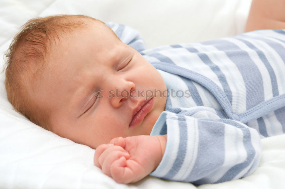 Similar – The back of a baby’s head lying on its stomach