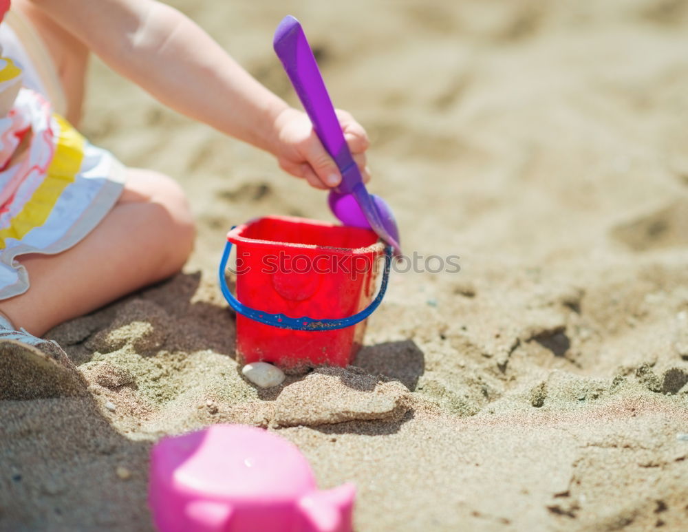 Similar – Image, Stock Photo Colourful toys in the sand