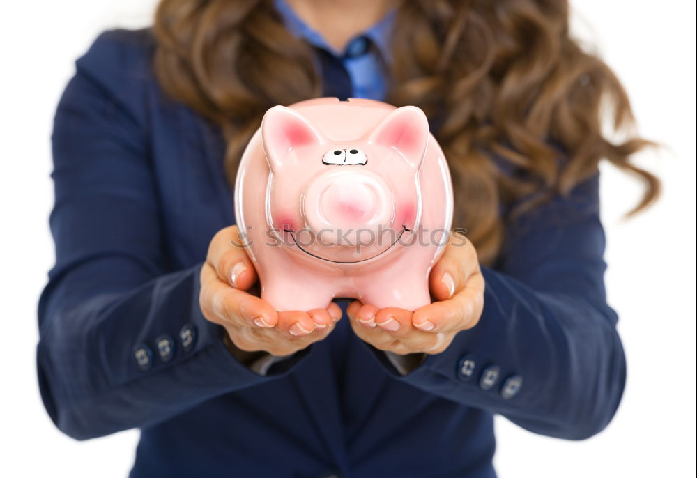 Similar – Thoughtful confused black woman with piggy bank