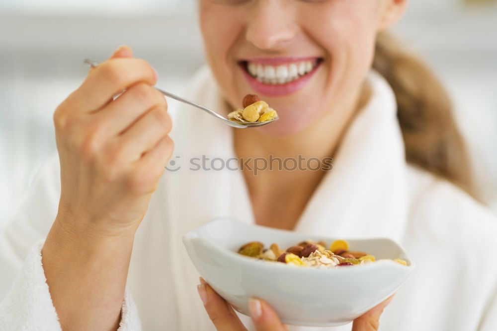 Similar – Image, Stock Photo woman close up eating oat and fruits bowl for breakfast