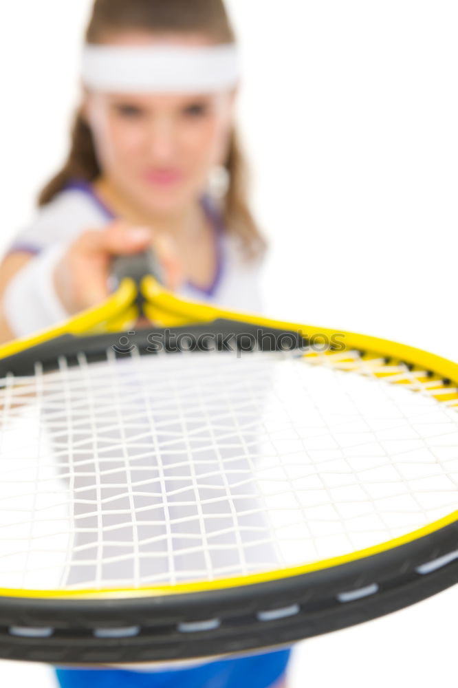 Similar – Face of a young woman hiding behind a featherball bat. Repeating the colour red. Sports grouch. Unsportsmanlike. Defense