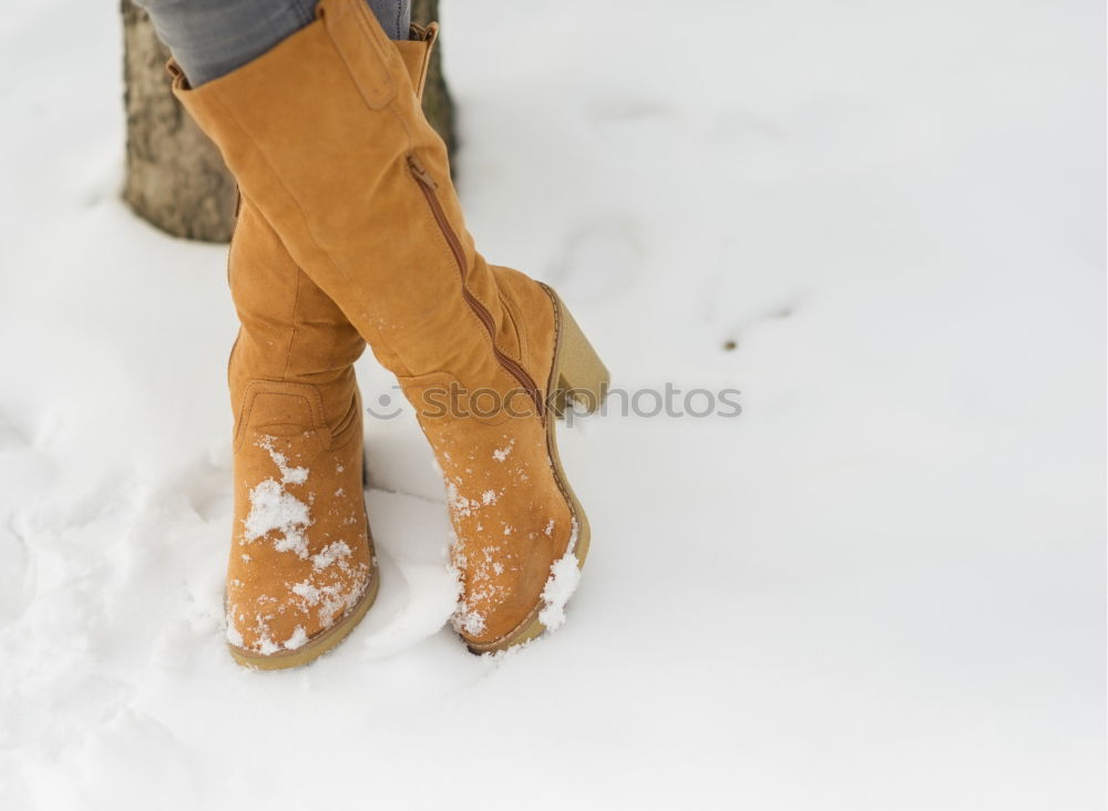 Similar – portrait woman boots on a road with snow in winter walking