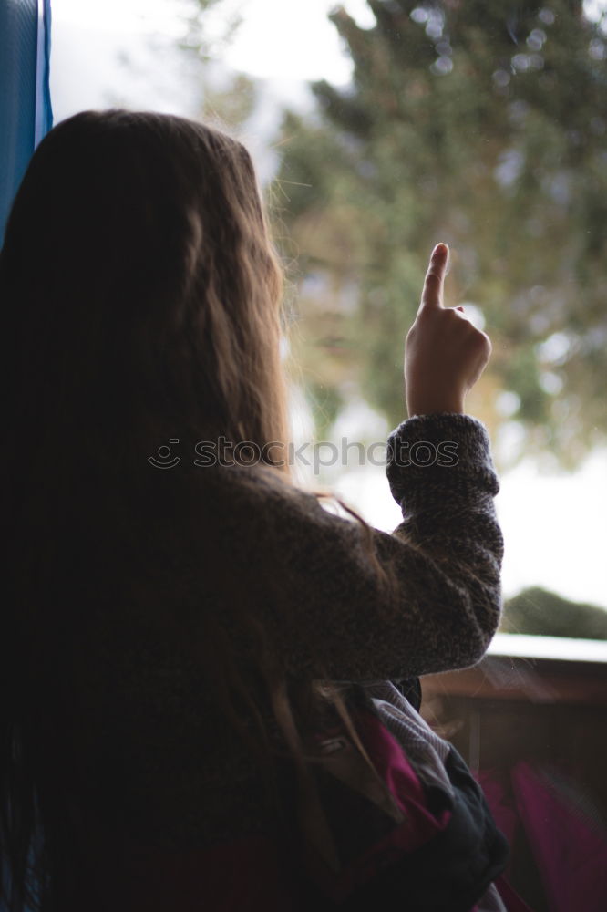 Similar – Image, Stock Photo Toddler looks curiously out of the train window