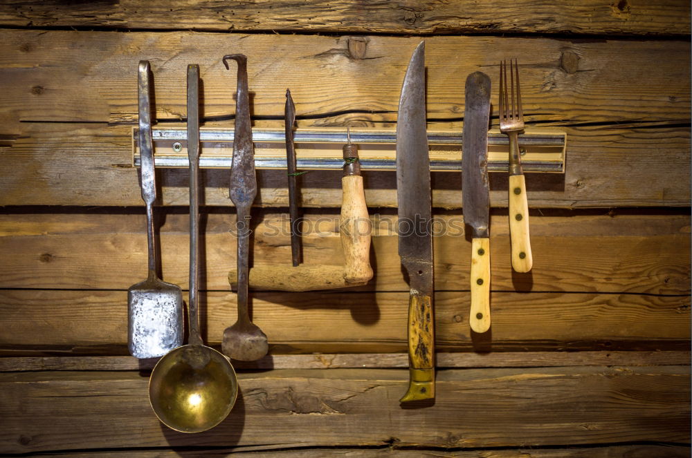 Similar – Cracking nuts with different tools, arranged next to crushed walnuts