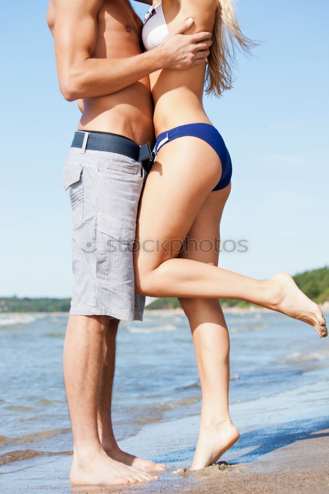 Similar – Image, Stock Photo Crop couple in swimsuit holding hands