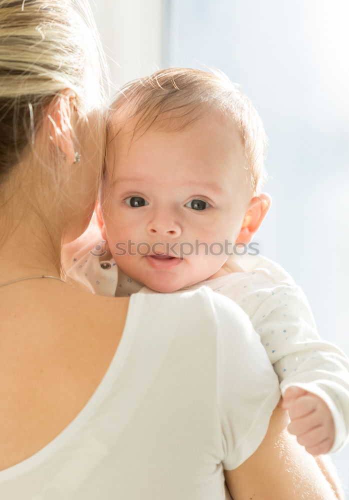 Similar – Image, Stock Photo Portrait of a mother with her baby at home.